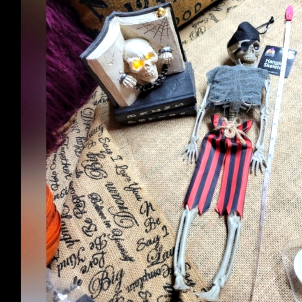 Halloween decorations hanging skeleton and a light up books